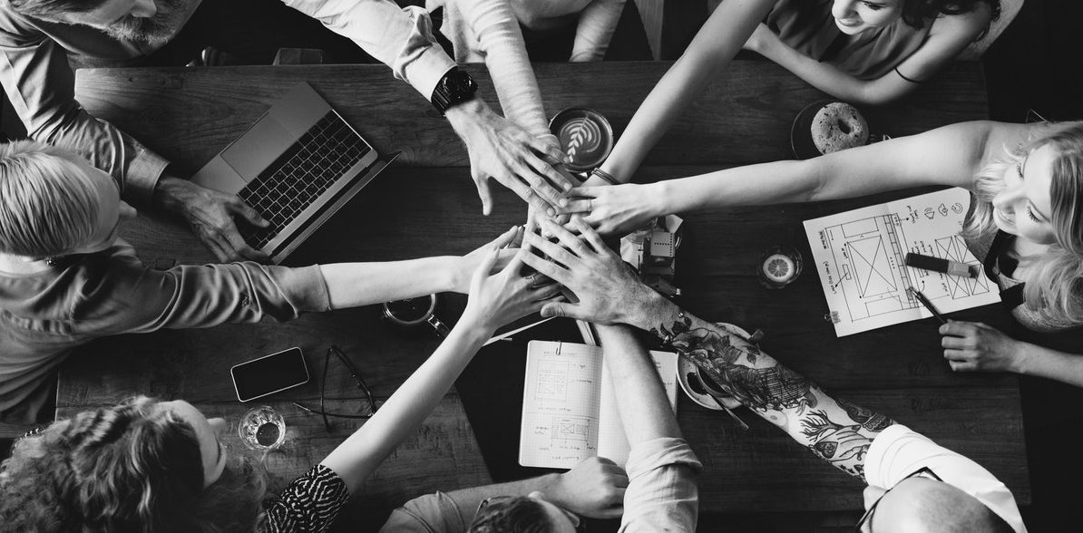 team with hands together